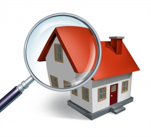 House hunting and searching for real estate homes for sale  that need to be inspected by a home inspector concept as a magnifying glass inspecting a model single home building structure.